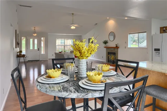 a view of a dining room with furniture and window