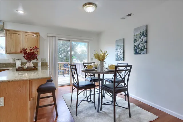 a kitchen with stainless steel appliances granite countertop a refrigerator sink and cabinets