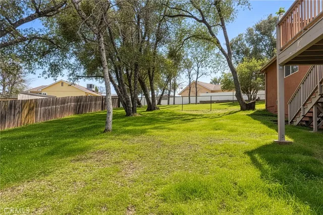 a backyard of a house with lots of green space