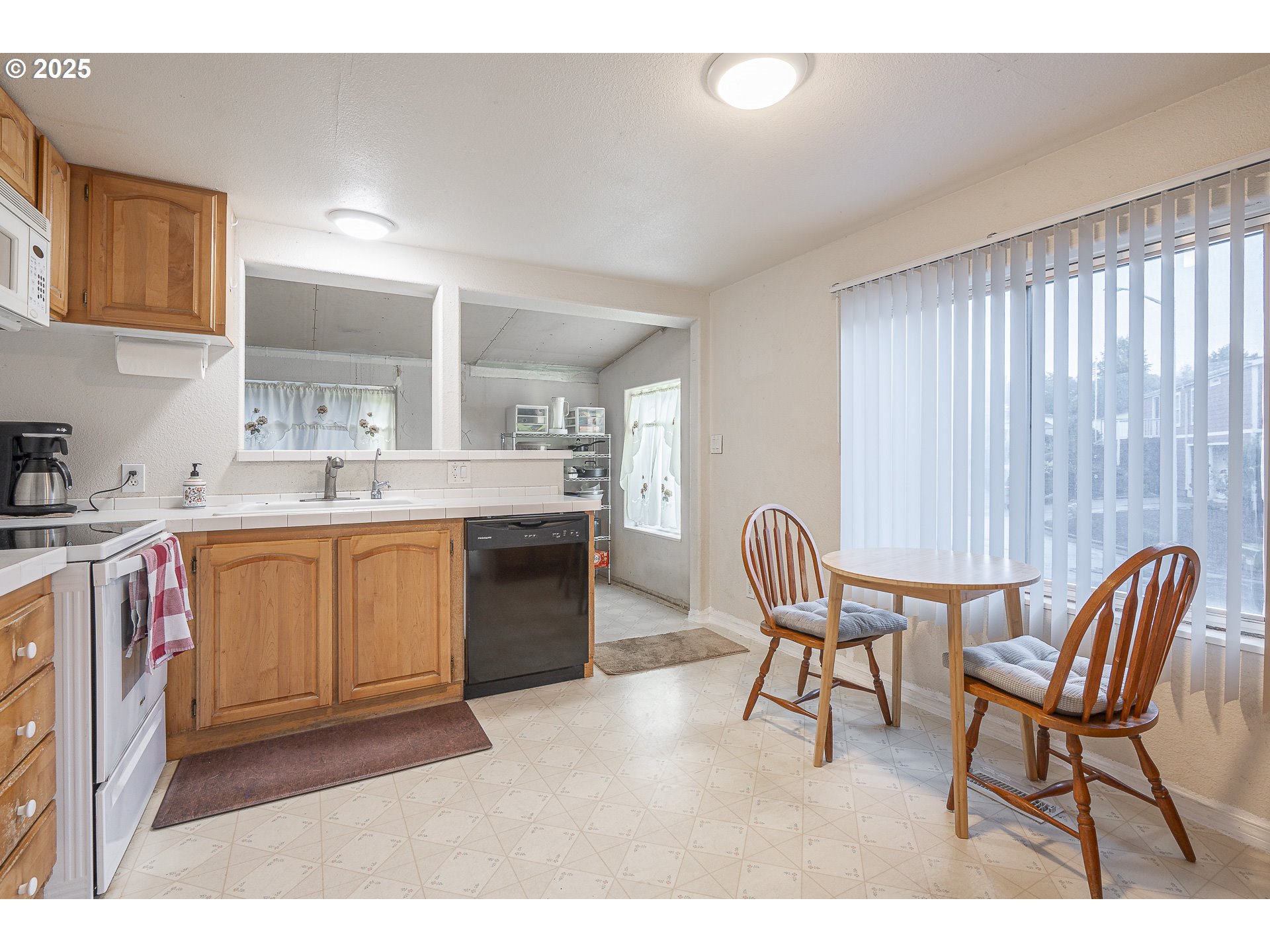 287 Canyon View Drive Lafayette, OR 97127 - Photo 32 of 33 a kitchen with stainless steel appliances kitchen island granite countertop a sink and cabinets