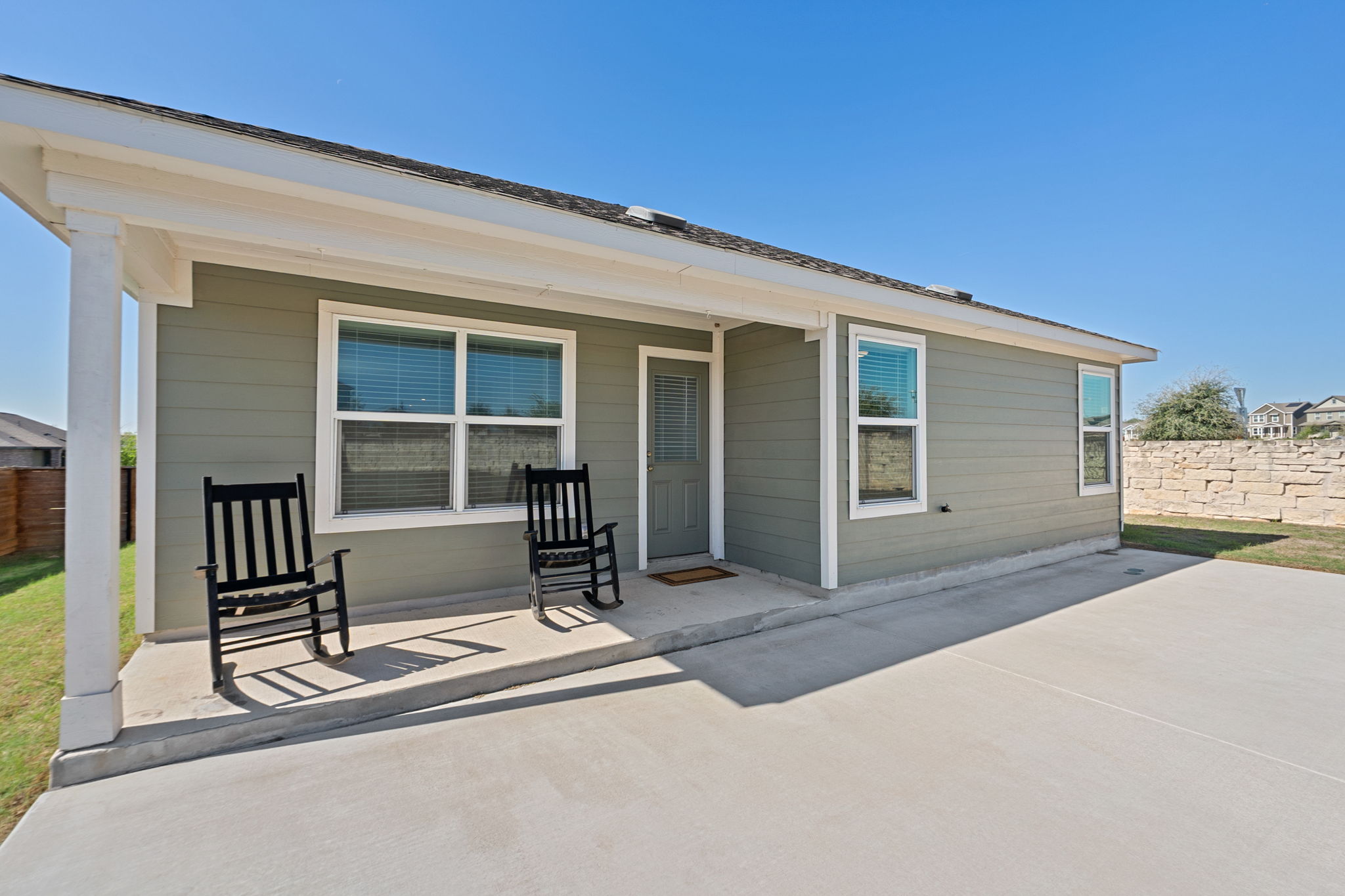 405 Doherty Kyle, TX 78640 - Photo 2 of 40 Enjoy the covered patio that overlooks the expansive yard!
