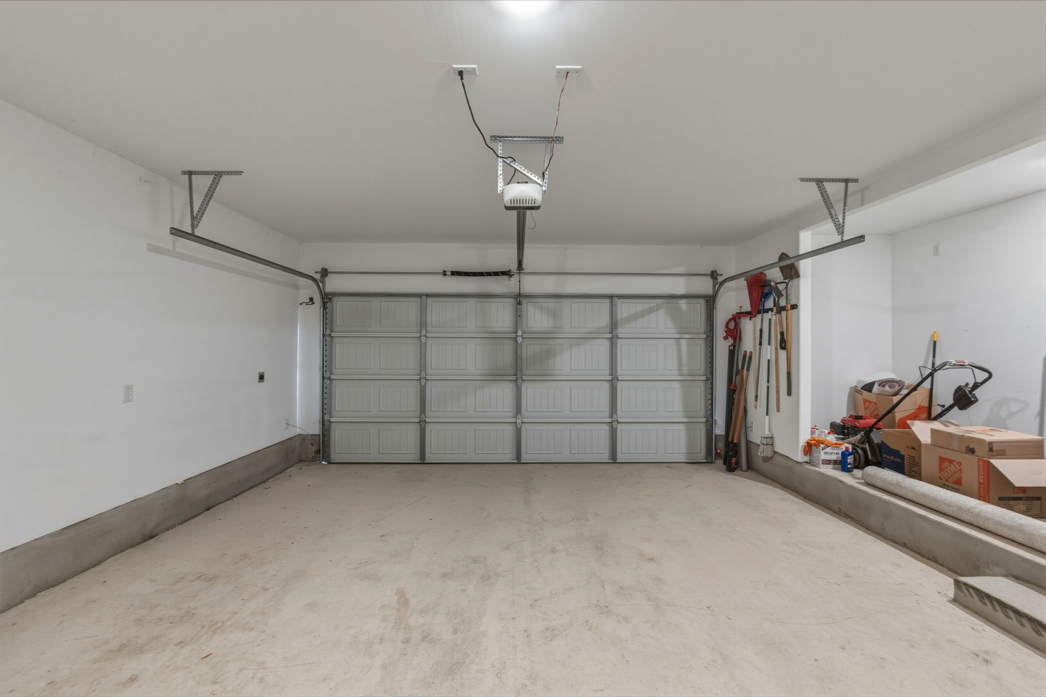 405 Doherty Kyle, TX 78640 - Photo 34 of 40 Extra storage space in the garage, garage door opener and plumbed for a water softener