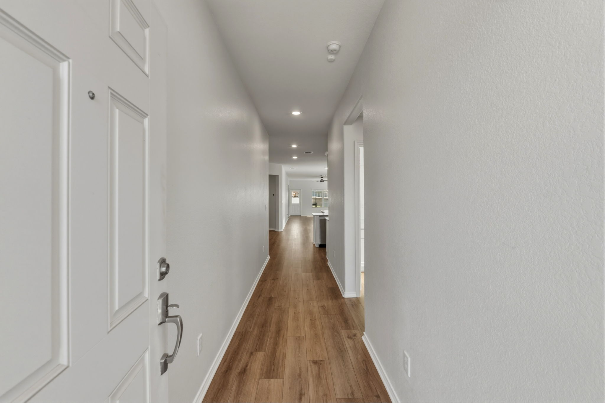 405 Doherty Kyle, TX 78640 - Photo 5 of 40 The home feels warm as you enter the foyer with luxury vinyl plank flooring!