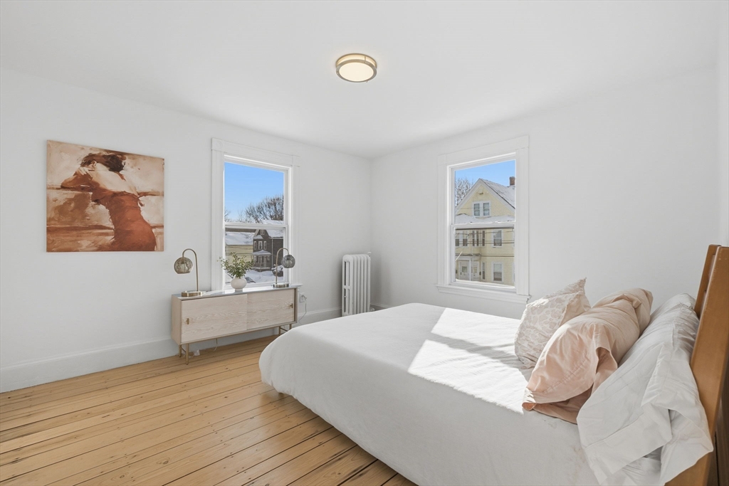 30 Massasoit Street Boston, MA 02136 - Photo 12 of 22 a bedroom with a large bed and a window