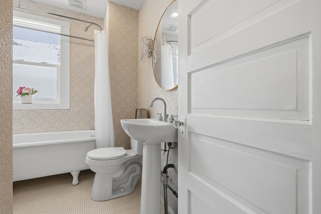 30 Massasoit Street Boston, MA 02136 - Photo 14 of 22 a bathroom with a sink toilet and shower