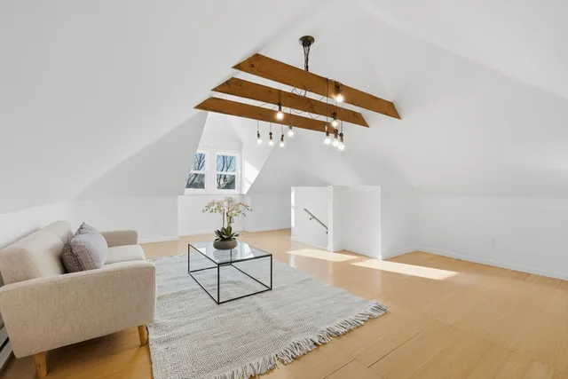 a living room with furniture and white walls