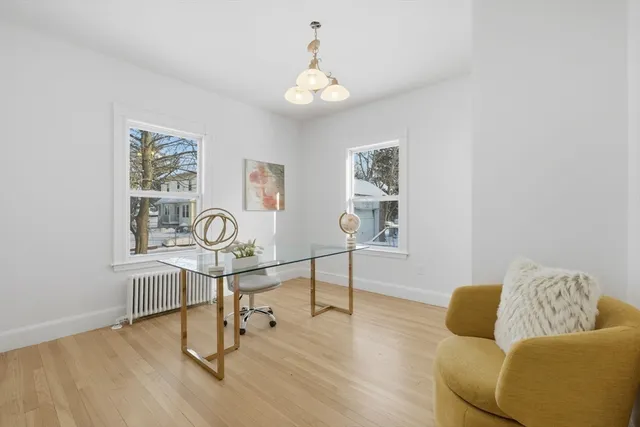 a view of a livingroom with furniture and a window
