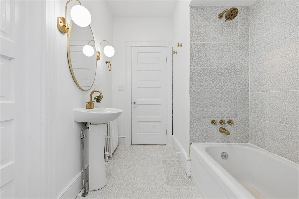 30 Massasoit Street Boston, MA 02136 - Photo 8 of 22 a bathroom with a sink a toilet and shower