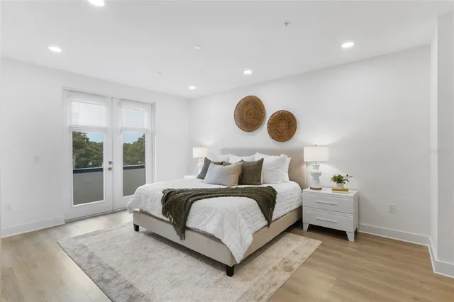 a bedroom with bed and window