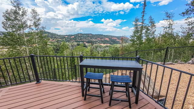 401 North Aoki Michi Road Brian Head, UT 84719 - Photo 50 of 58 Outdoor deck with composite wood-finish flooring and black metal railing