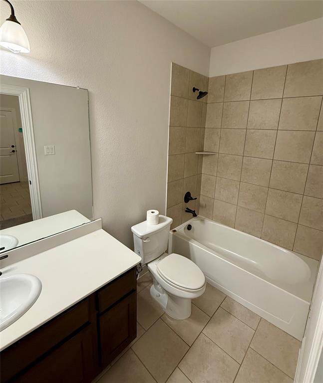 204 Flower Ridge Drive Fort Worth, TX 76108 - Photo 9 of 27 a bathroom with a sink a toilet a mirror a bathtub and shower