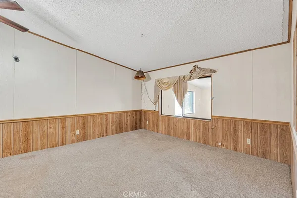 a living room with stainless steel appliances kitchen island granite countertop furniture and a kitchen view