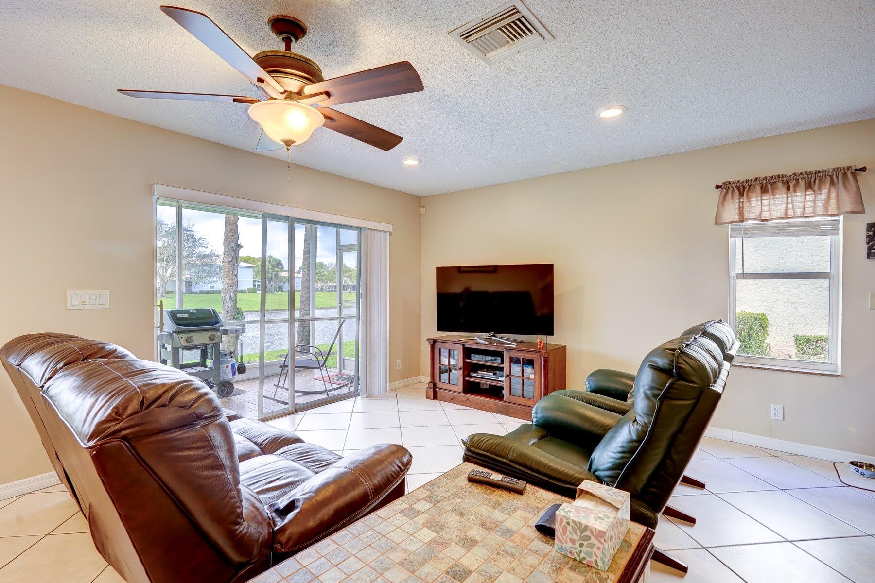 254 Timberwalk Trail Jupiter, FL 33458 - Photo 15 of 45 living room overlooking the lake