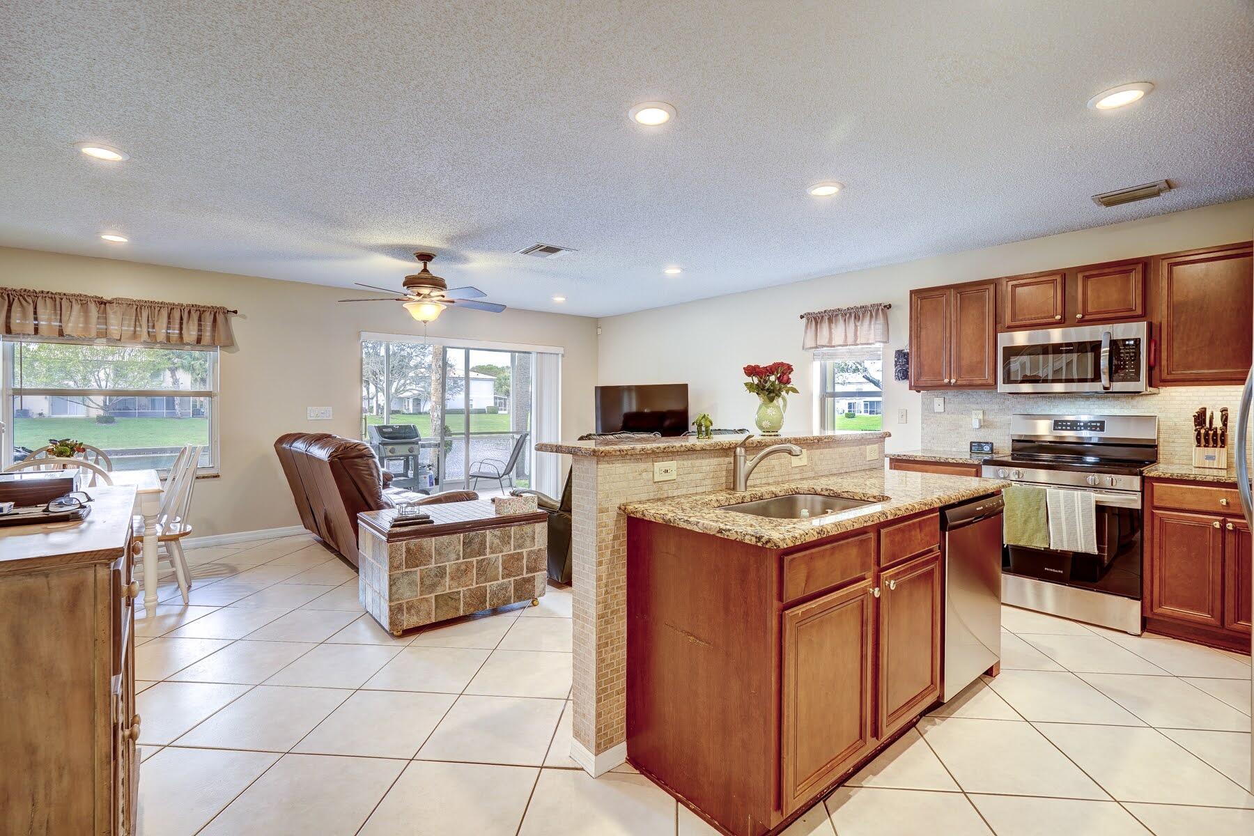 254 Timberwalk Trail Jupiter, FL 33458 - Photo 9 of 45 kitchen/living room