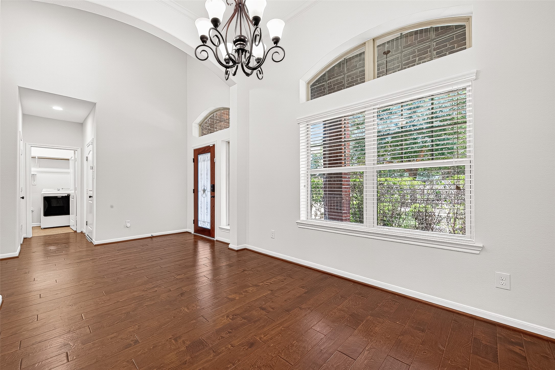 138 South Sawbridge Circle Spring, TX 77389 - Photo 6 of 37 a view of an empty room with wooden floor and a window