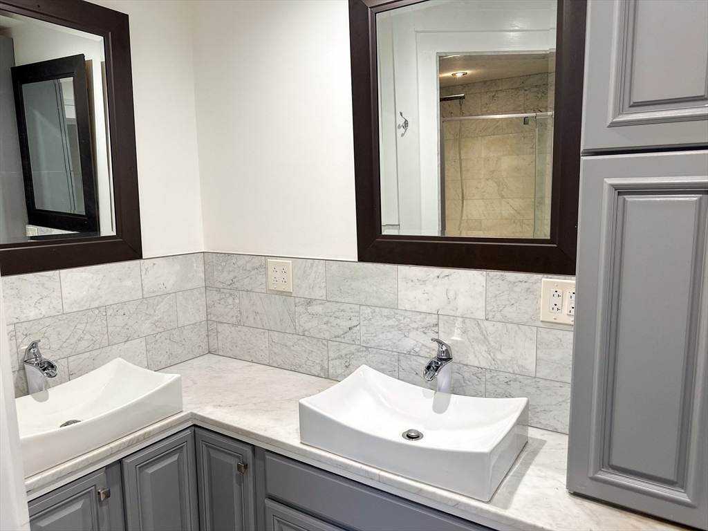 125 Maple Street Carlisle, MA 01741 - Photo 20 of 35 a bathroom with a sink and a mirror