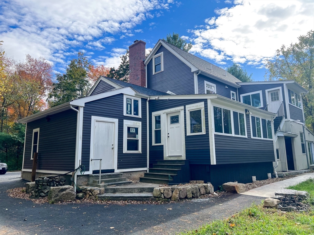 125 Maple Street Carlisle, MA 01741 - Photo 23 of 35 a view of a house with a yard