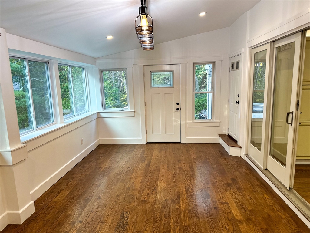 125 Maple Street Carlisle, MA 01741 - Photo 9 of 35 a view of an empty room with wooden floor and a window