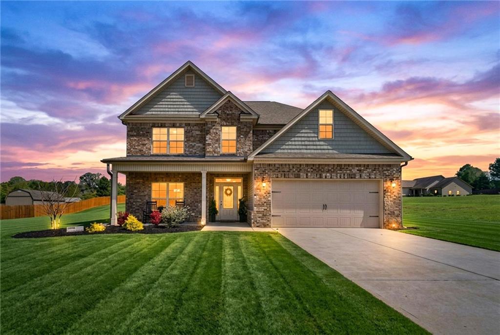 a front view of a house with a yard