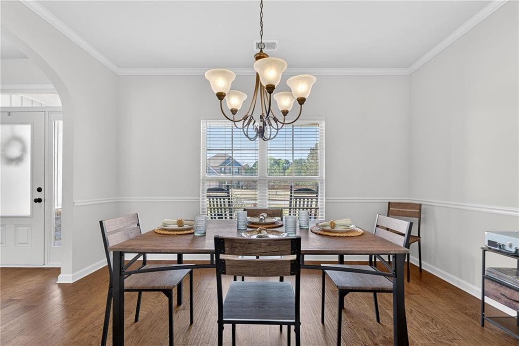 214 Millie Court Jackson, GA 30233 - Photo 11 of 61 a view of a dining room with furniture window and wooden floor
