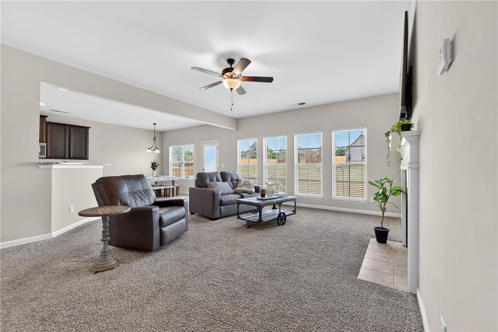 214 Millie Court Jackson, GA 30233 - Photo 15 of 61 a living room with furniture and large windows