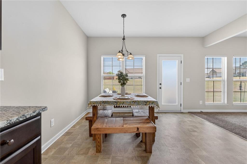 214 Millie Court Jackson, GA 30233 - Photo 23 of 61 a view of a livingroom with furniture and window