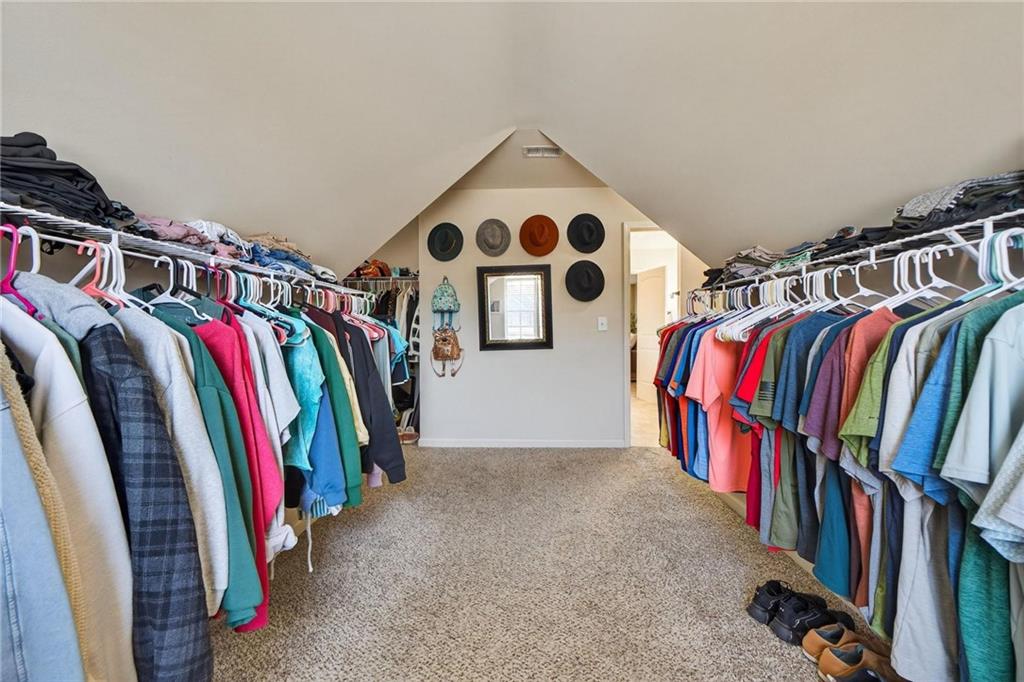 214 Millie Court Jackson, GA 30233 - Photo 37 of 61 a view of walk in closet with clothes and shoes