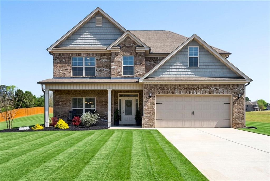 214 Millie Court Jackson, GA 30233 - Photo 4 of 61 a view of a house with garden and yard