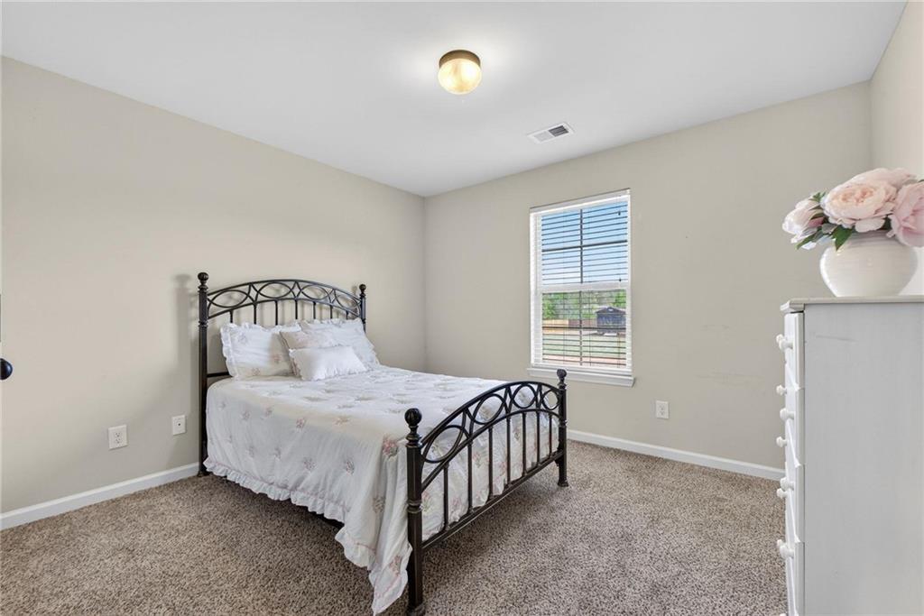 214 Millie Court Jackson, GA 30233 - Photo 41 of 61 a bedroom with a bed and window