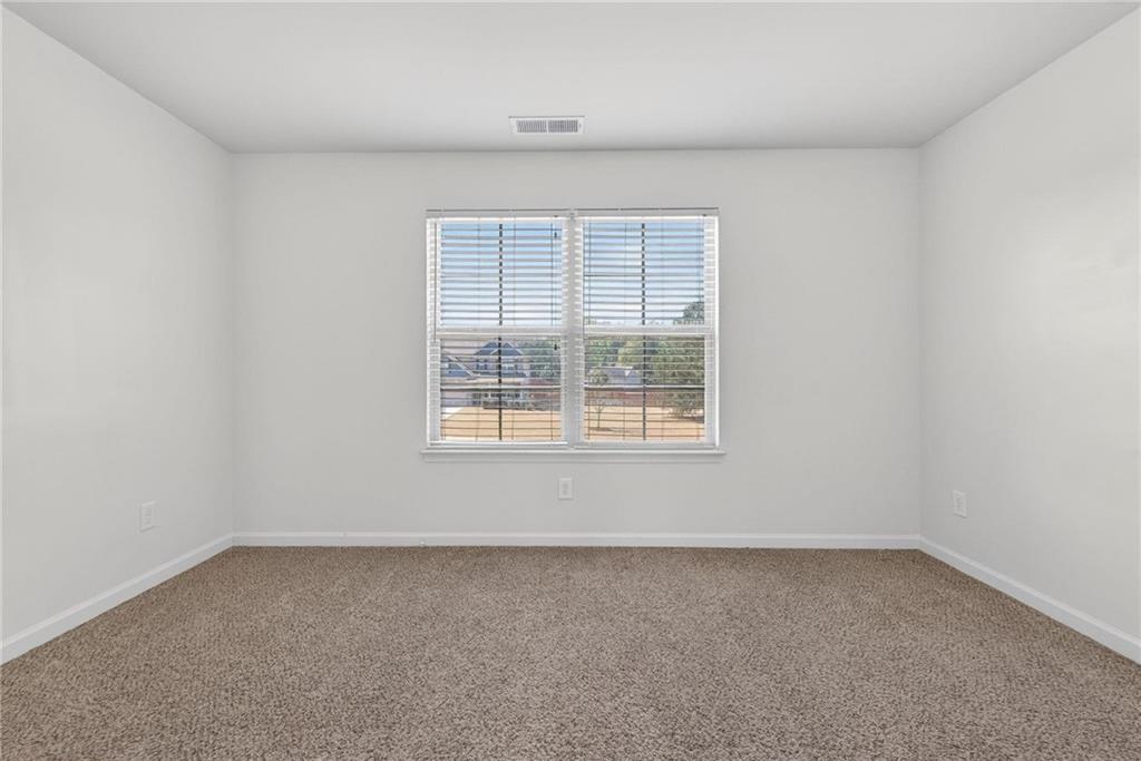 214 Millie Court Jackson, GA 30233 - Photo 44 of 61 an empty room with a window