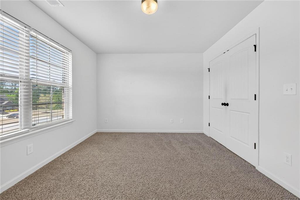 214 Millie Court Jackson, GA 30233 - Photo 46 of 61 a view of an empty room with a window