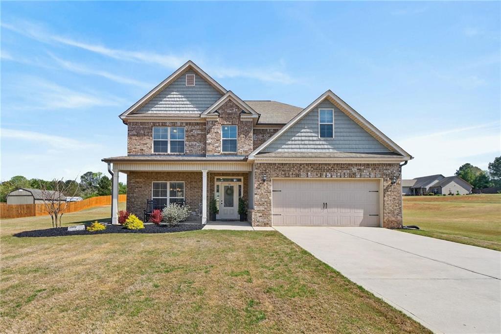 214 Millie Court Jackson, GA 30233 - Photo 54 of 61 a front view of a house with garden
