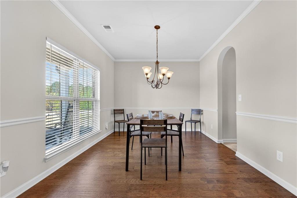 214 Millie Court Jackson, GA 30233 - Photo 10 of 61 a view of a dining room with furniture window and wooden floor