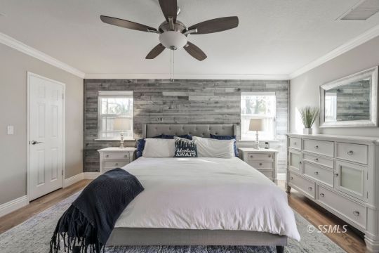 1113 Amie Court Ridgecrest, CA 93555 - Photo 25 of 33 a bedroom with a bed a dresser and a window