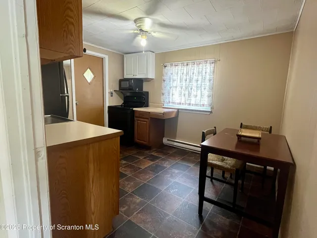 a kitchen with a refrigerator and a sink