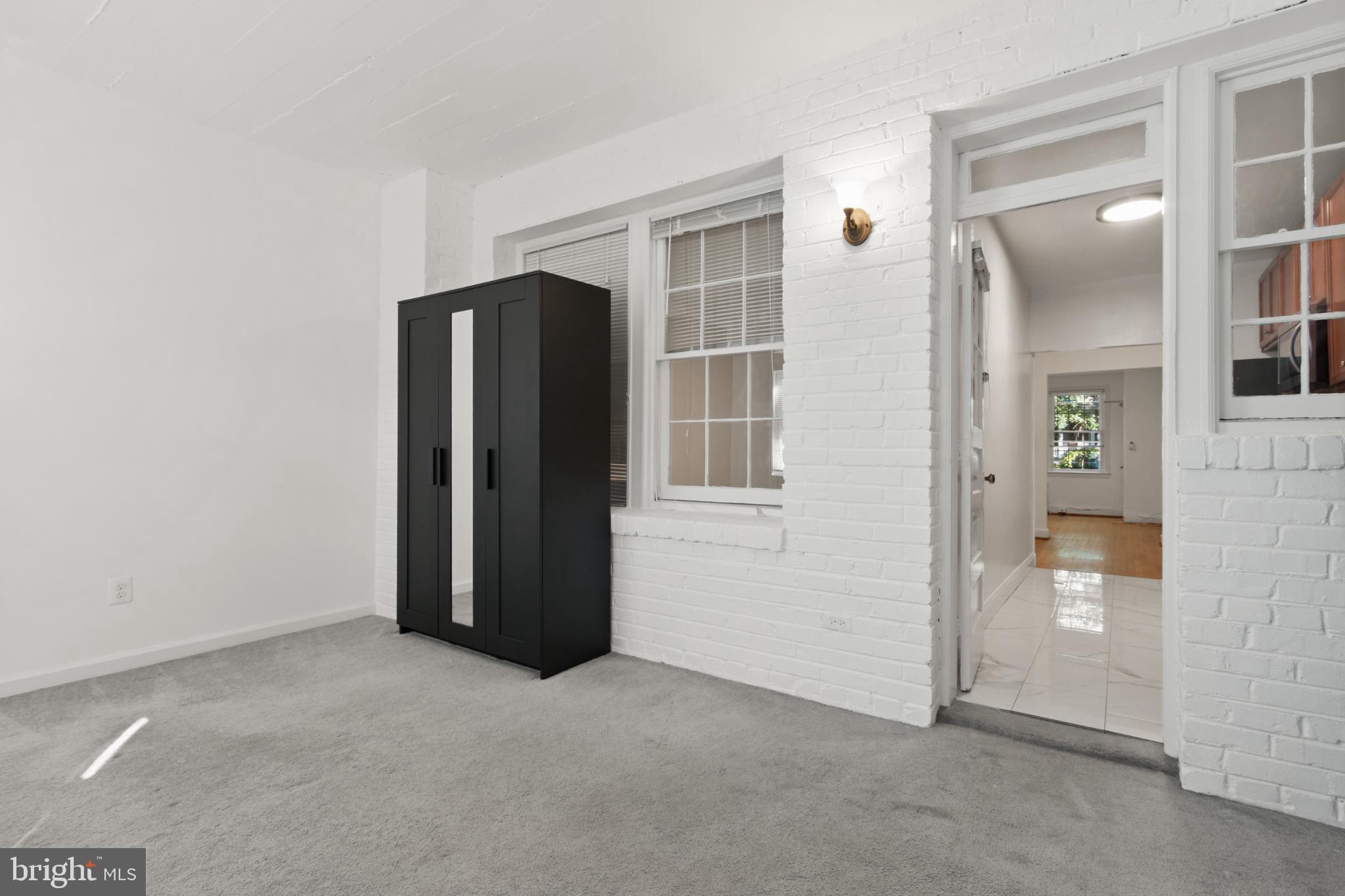 4500 MacArthur Boulevard Northwest Washington, DC 20007 - Photo 12 of 16 an empty room with windows and closet