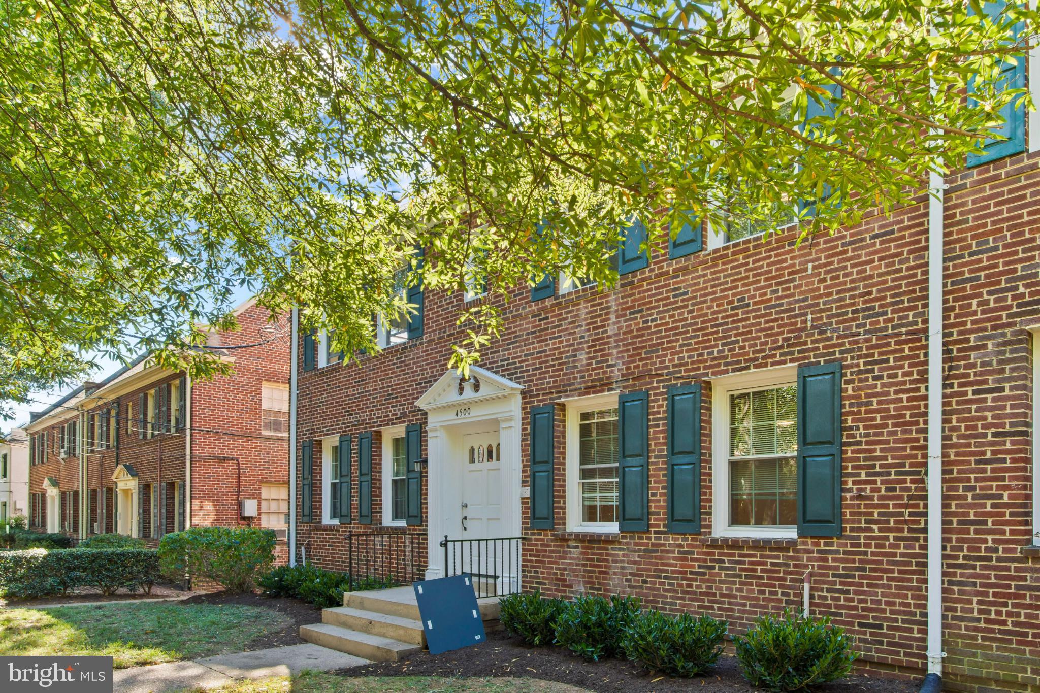 4500 MacArthur Boulevard Northwest Washington, DC 20007 - Photo 2 of 16 a front view of a house with garden