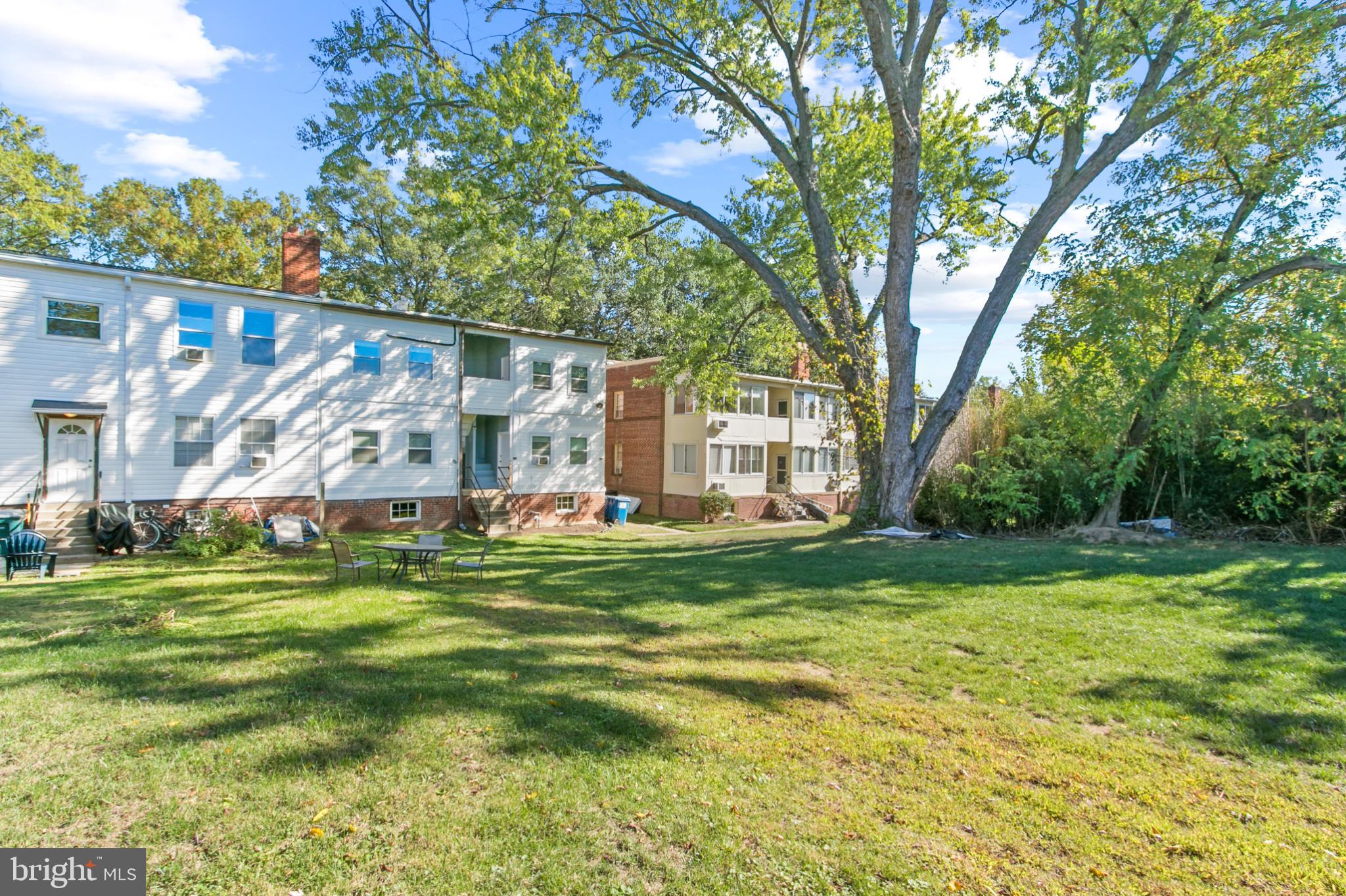 4500 MacArthur Boulevard Northwest Washington, DC 20007 - Photo 7 of 16 a backyard of a house with lots of green space and fountain