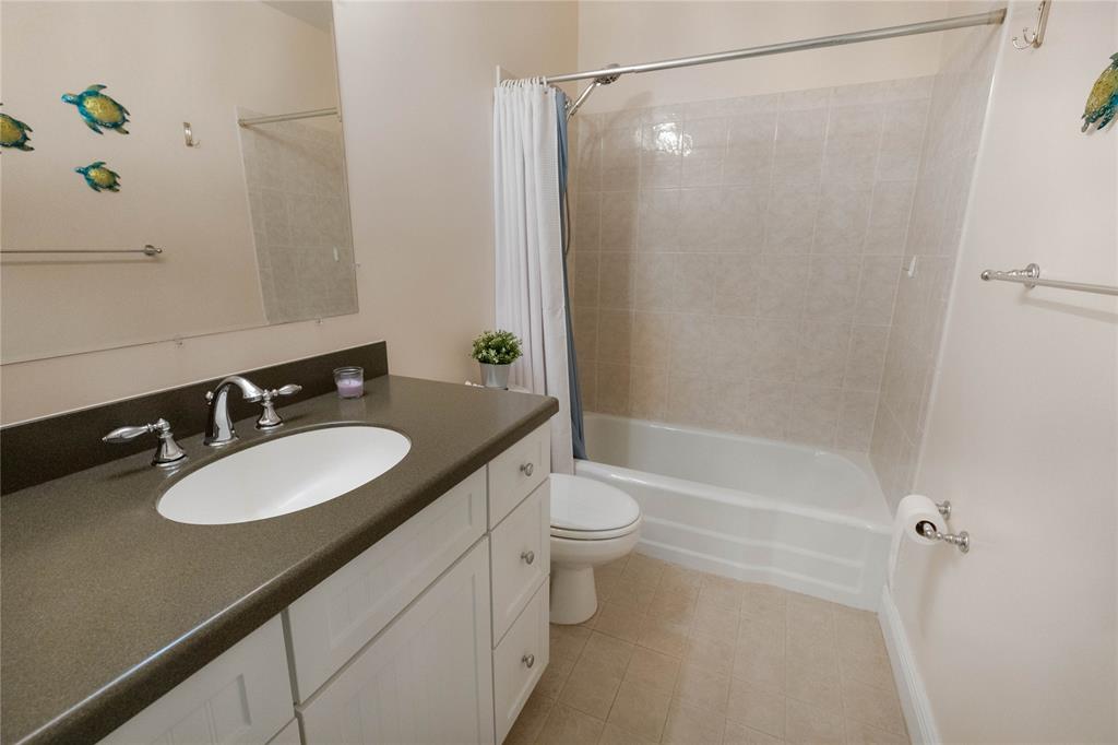 750 Pine Drive, Unit 11 Pompano Beach, FL 33060 - Photo 18 of 22 a bathroom with a granite countertop sink toilet and shower
