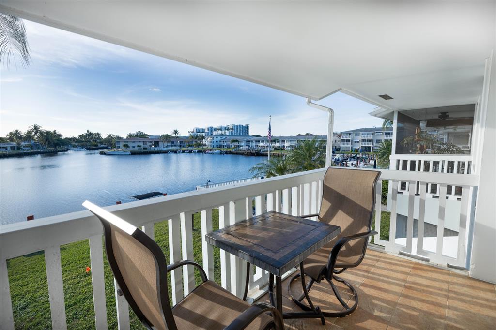 750 Pine Drive, Unit 11 Pompano Beach, FL 33060 - Photo 2 of 22 a view of a chairs on the roof deck