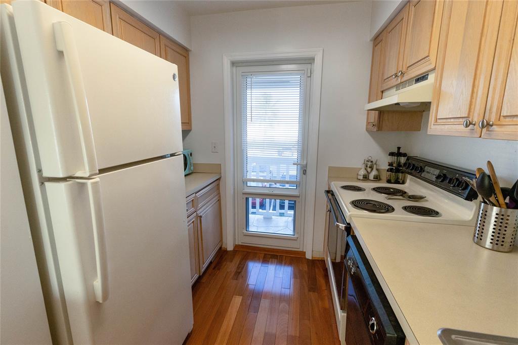 750 Pine Drive, Unit 11 Pompano Beach, FL 33060 - Photo 6 of 22 a kitchen with a refrigerator a sink and a stove