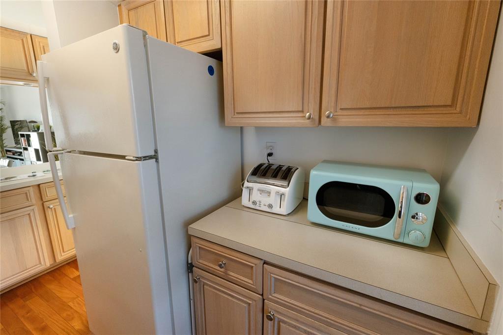 750 Pine Drive, Unit 11 Pompano Beach, FL 33060 - Photo 7 of 22 a white refrigerator freezer sitting inside of a kitchen