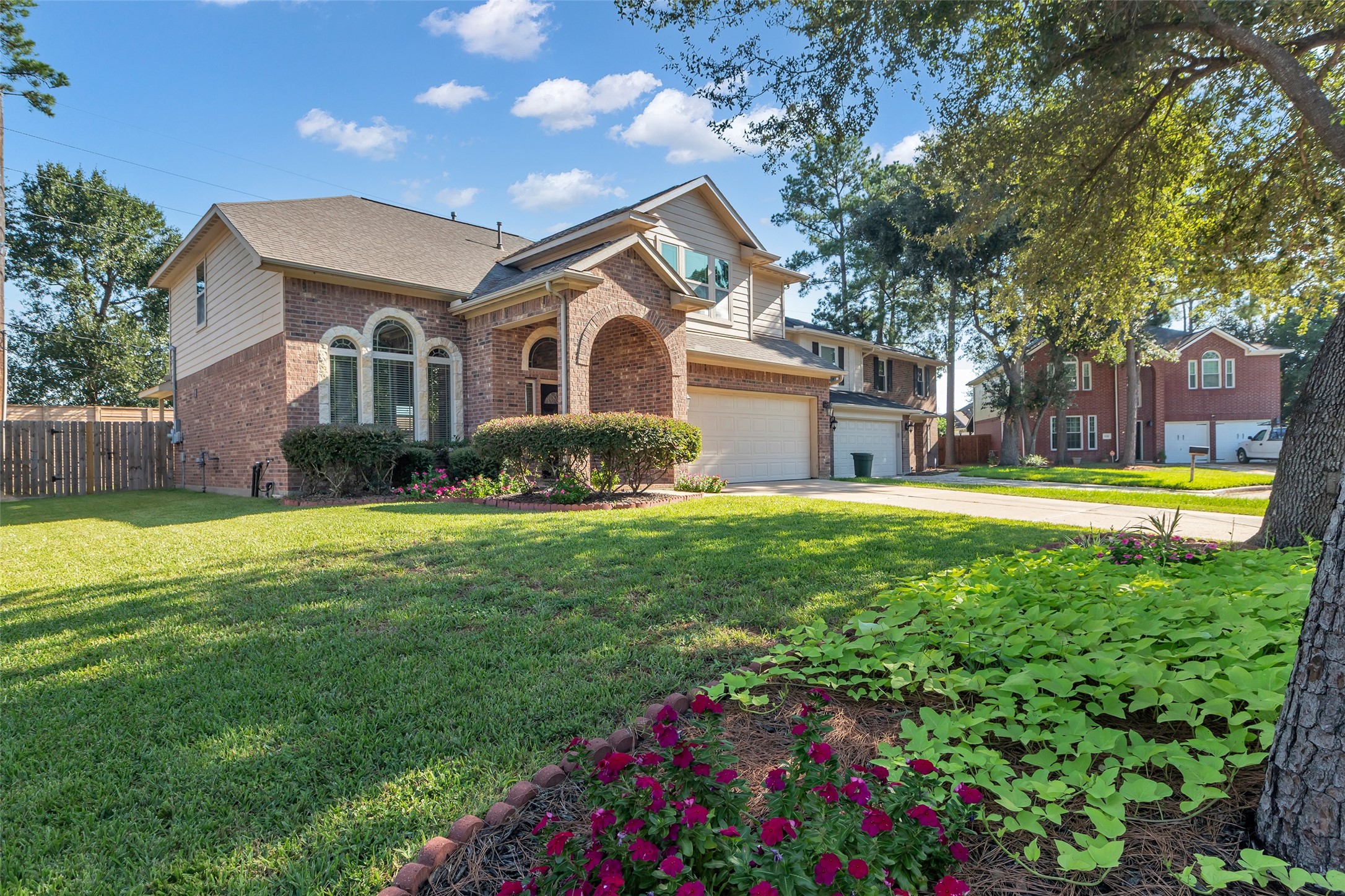 a front view of house with yard and green space