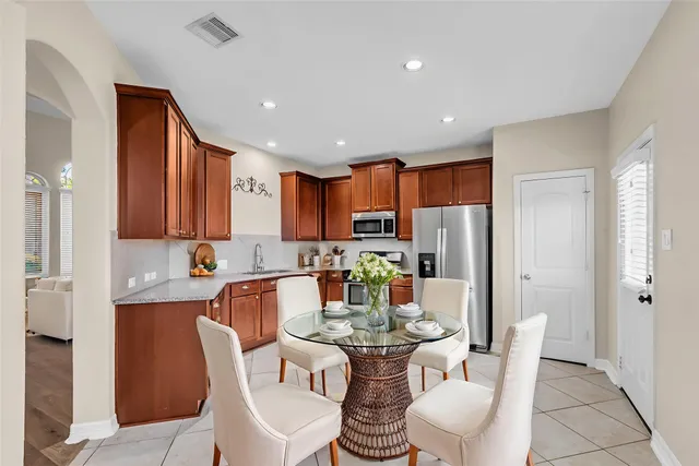 a dining room with furniture a window and kitchen view