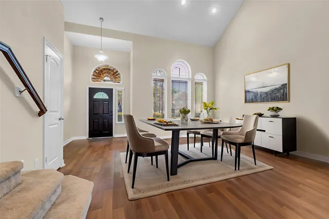 a view of a livingroom with furniture window and wooden floor