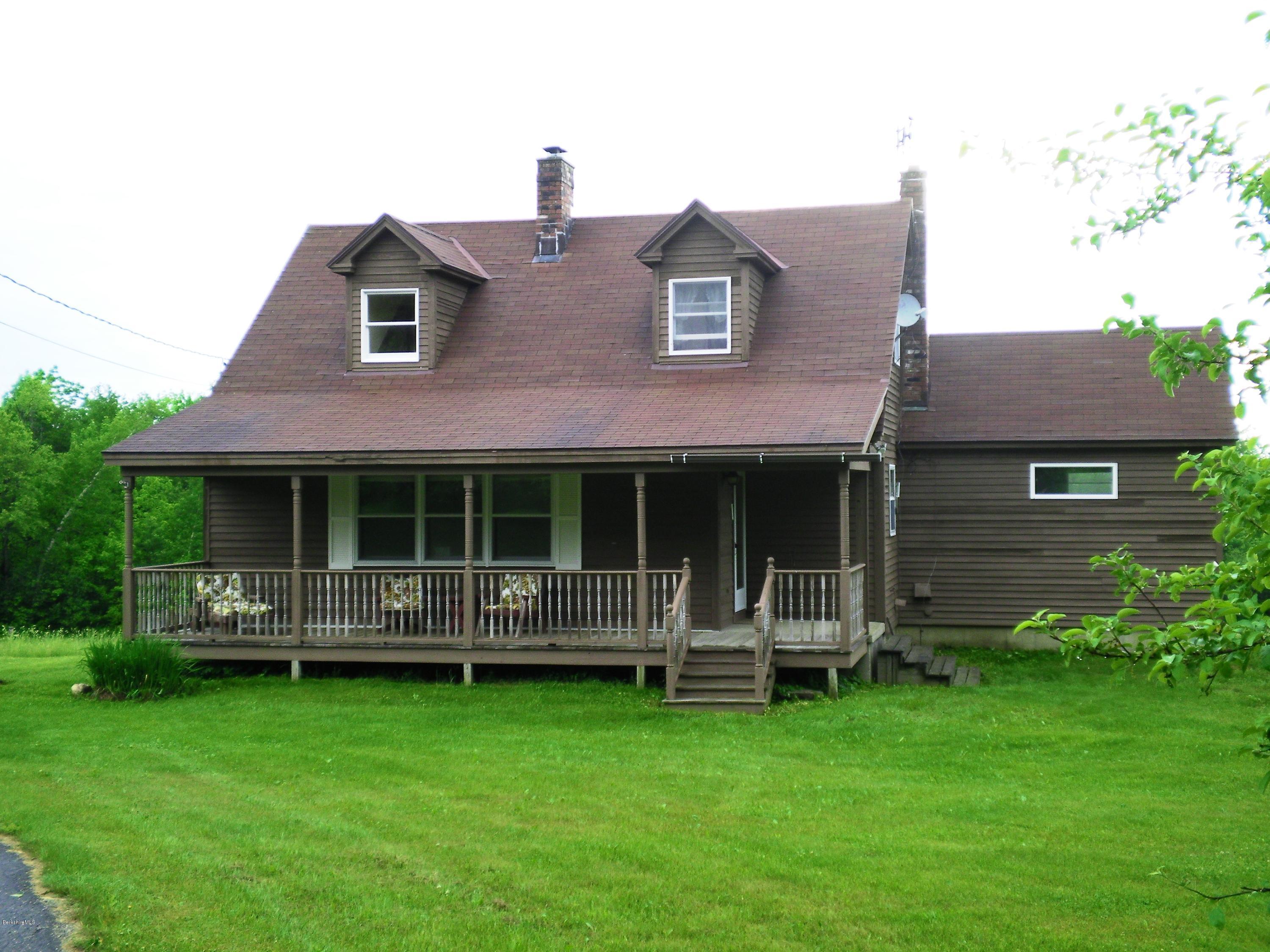 7 Pierce Road Peru, MA 01235 - Photo 1 of 29 a front view of a house with garden