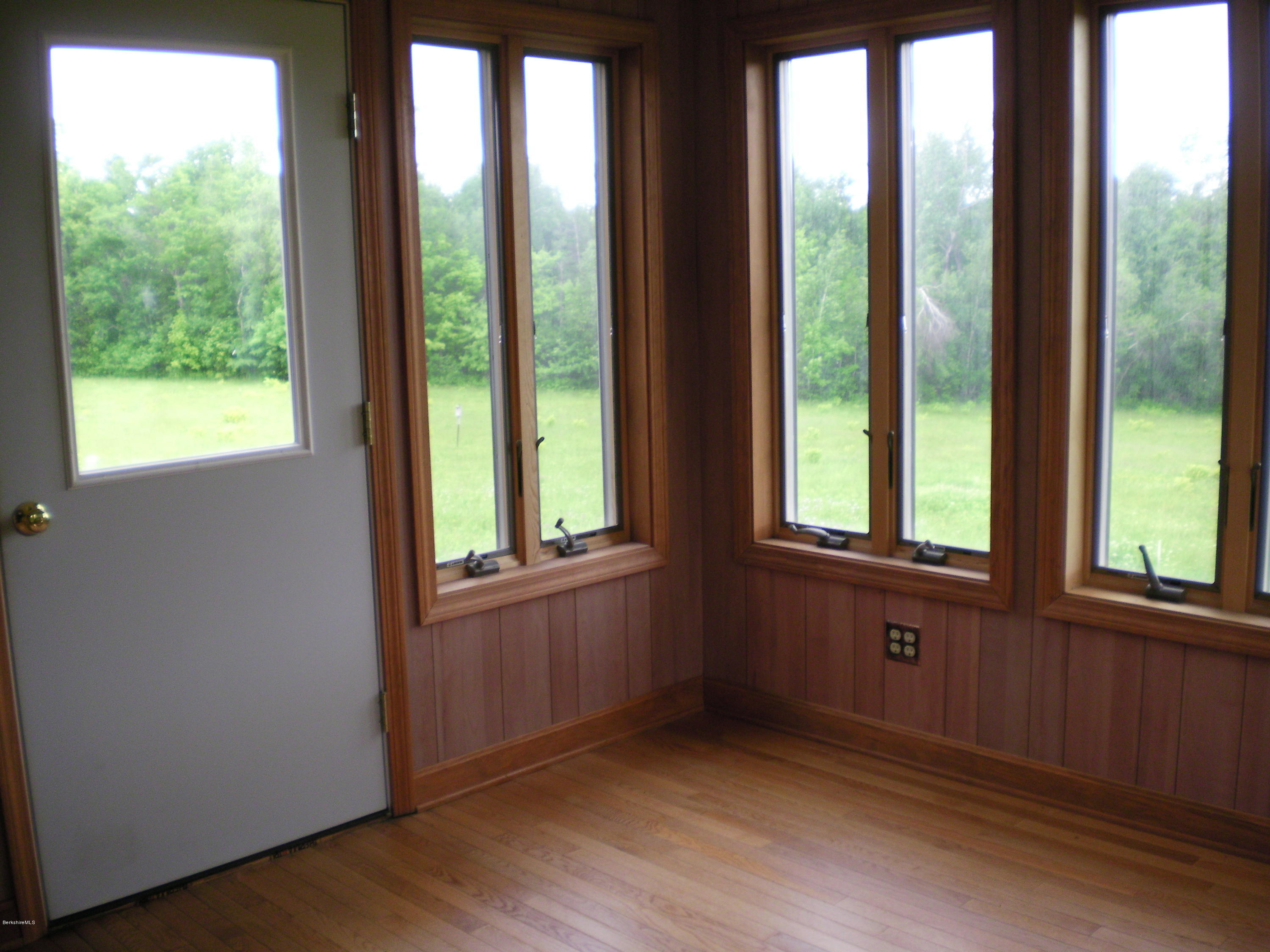 7 Pierce Road Peru, MA 01235 - Photo 12 of 29 a view of an empty room with wooden floor and a window
