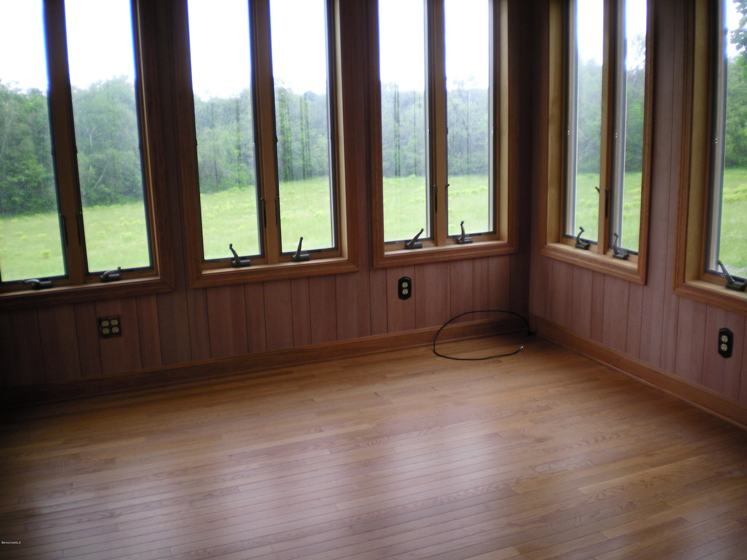 7 Pierce Road Peru, MA 01235 - Photo 13 of 29 a view of an empty room with a window and wooden floor