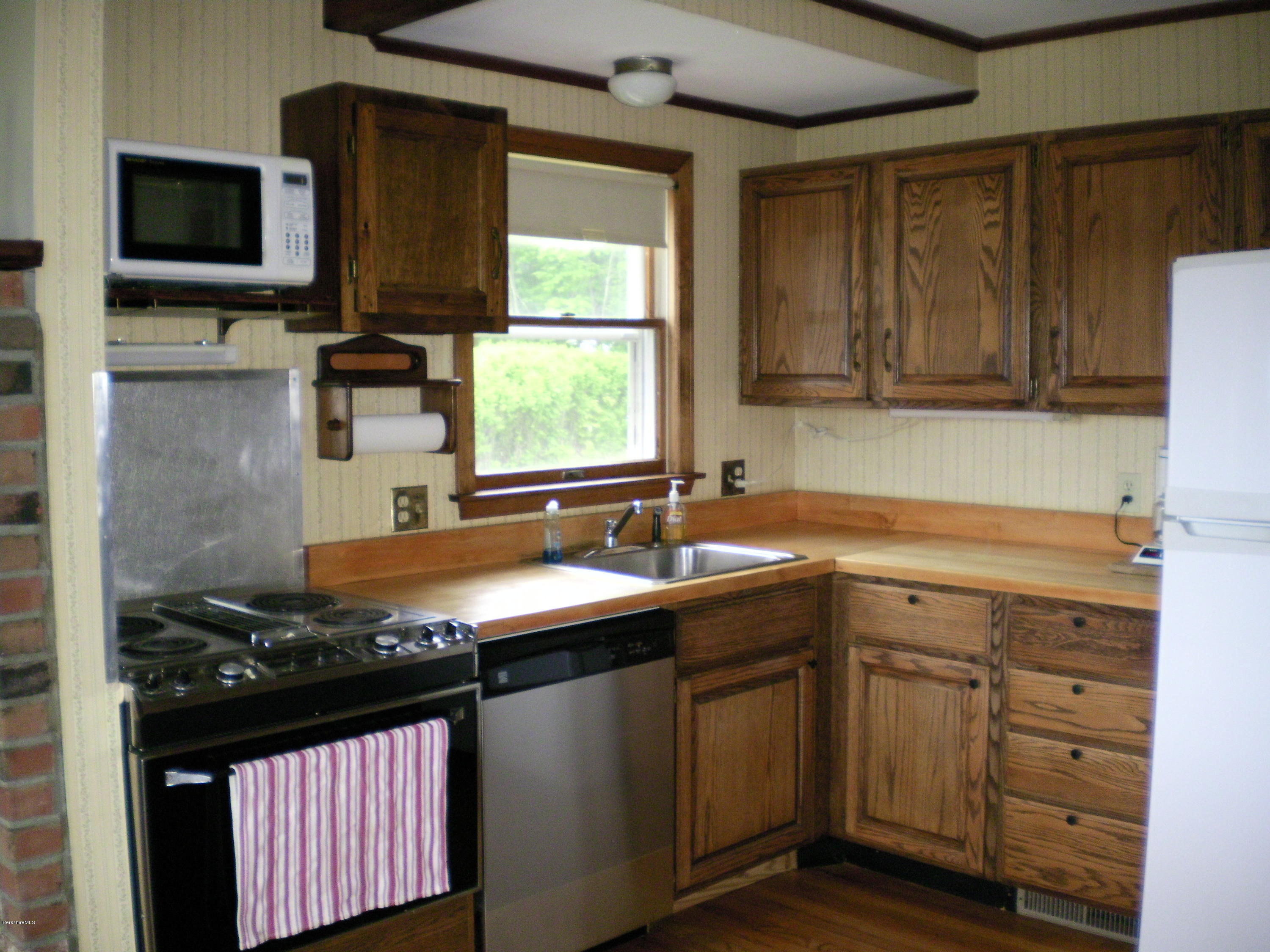 7 Pierce Road Peru, MA 01235 - Photo 14 of 29 a kitchen with a sink stove and microwave