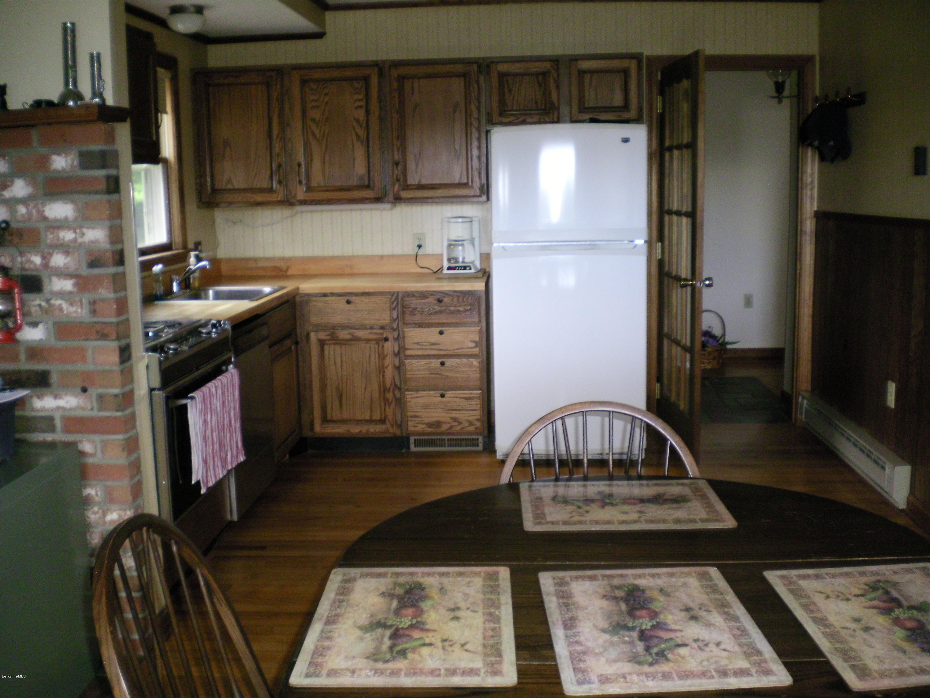 7 Pierce Road Peru, MA 01235 - Photo 15 of 29 a kitchen with a sink a stove and a refrigerator